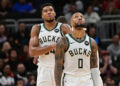 Oct 14, 2024; Milwaukee, Wisconsin, USA; Milwaukee Bucks forward Giannis Antetokounmpo (34) and guard Damian Lillard (0) look on in the second quarter against the Chicago Bulls at Fiserv Forum. Mandatory Credit: Benny Sieu-Imagn Images