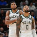 Oct 14, 2024; Milwaukee, Wisconsin, USA; Milwaukee Bucks forward Giannis Antetokounmpo (34) and guard Damian Lillard (0) look on in the second quarter against the Chicago Bulls at Fiserv Forum. Mandatory Credit: Benny Sieu-Imagn Images