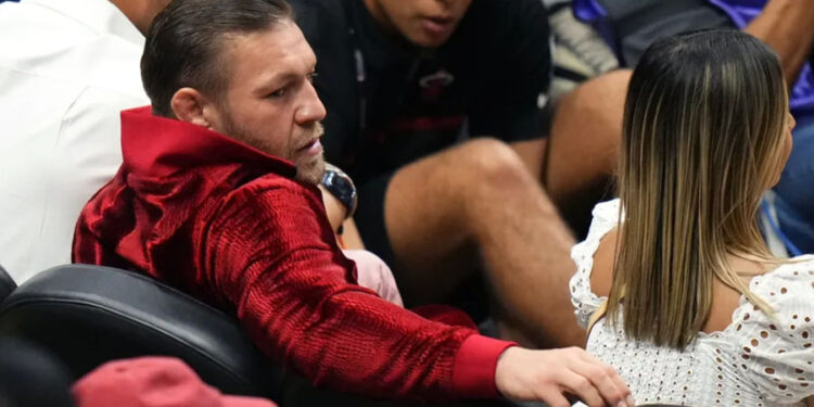 Jun 9, 2023; Miami, Florida, USA; Irish mixed martial artist Conor McGregor looks on during the first half in game four of the 2023 NBA Finals between the Miami Heat and the Denver Nuggets at Kaseya Center. Mandatory Credit: Rich Storry-Imagn Images