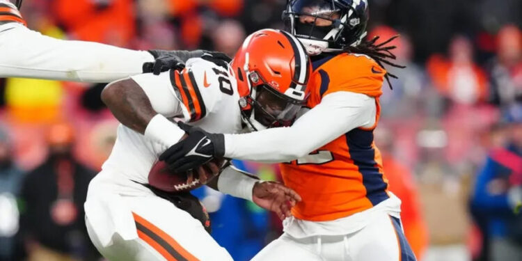 Nov 26, 2023; Denver, Colorado, USA; Denver Broncos linebacker Nik Bonitto (42) sacks Cleveland Browns quarterback PJ Walker (10) in the second half at Empower Field at Mile High. credits: Ron Chenoy-USA TODAY Sports