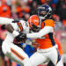 Nov 26, 2023; Denver, Colorado, USA; Denver Broncos linebacker Nik Bonitto (42) sacks Cleveland Browns quarterback PJ Walker (10) in the second half at Empower Field at Mile High. credits: Ron Chenoy-USA TODAY Sports