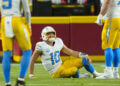 Dec 8, 2024; Kansas City, Missouri, USA; Los Angeles Chargers quarterback Justin Herbert (10) reacts after an injury during the first half against the Kansas City Chiefs at GEHA Field at Arrowhead Stadium. Mandatory Credit: Jay Biggerstaff-Imagn Images