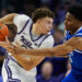 Dec 17, 2024; Kansas City, Missouri, USA; Kansas State Wildcats guard Coleman Hawkins (33) looks to pass against Drake Bulldogs guard Tavion Banks (6) during the second half at T-Mobile Center. Mandatory Credit: Jay Biggerstaff-Imagn Images