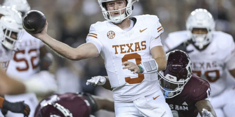 Nov 30, 2024; College Station, Texas, USA; Texas Longhorns quarterback Quinn Ewers (3) attempts a pass as Texas A&amp;M Aggies linebacker Scooby Williams (0) applies defensive pressure during the first quarter at Kyle Field. Mandatory Credit: Troy Taormina-Imagn Images