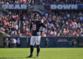 Oct 6, 2024; Chicago, Illinois, USA; Chicago Bears quarterback Caleb Williams (18) looks on against the Carolina Panthers during the fourth quarter at Soldier Field. Mandatory Credit: Daniel Bartel-Imagn Images