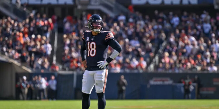 Oct 6, 2024; Chicago, Illinois, USA; Chicago Bears quarterback Caleb Williams (18) looks on against the Carolina Panthers during the fourth quarter at Soldier Field. Mandatory Credit: Daniel Bartel-Imagn Images