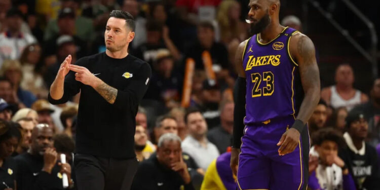 Oct 28, 2024; Phoenix, Arizona, USA; Los Angeles Lakers head coach JJ Redick with forward LeBron James (23) against the Phoenix Suns at Footprint Center. Mandatory Credit: Mark J. Rebilas-Imagn Images