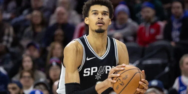 Dec 23, 2024; Philadelphia, Pennsylvania, USA; San Antonio Spurs center Victor Wembanyama (1) shoots the ball against the Philadelphia 76ers during the fourth quarter at Wells Fargo Center. Mandatory Credit: Bill Streicher-Imagn Images