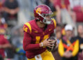 Nov 30, 2024; Los Angeles, California, USA; Southern California Trojans quarterback Jayden Maiava (14) throws the ball against the Notre Dame Fighting Irish in the first half at United Airlines Field at Los Angeles Memorial Coliseum. Mandatory Credit: Kirby Lee-Imagn Images