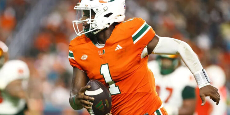 Sep 7, 2024; Miami Gardens, Florida, USA; Miami Hurricanes quarterback Cam Ward (1) runs with the football for a touchdown against the Florida A&amp;M Rattlers during the third quarter at Hard Rock Stadium. Mandatory Credit: Sam Navarro-Imagn Images