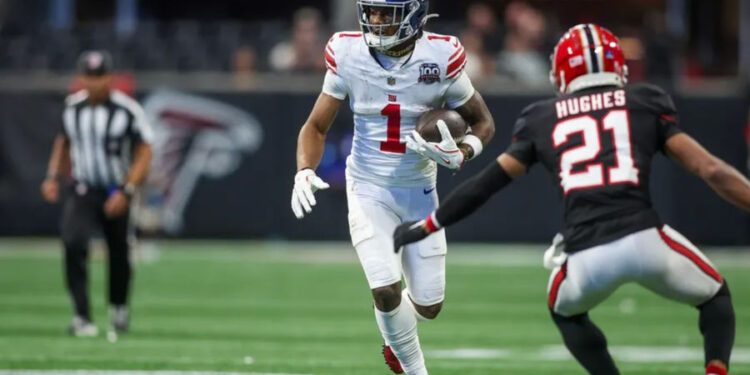 Dec 22, 2024; Atlanta, Georgia, USA; New York Giants wide receiver Malik Nabers (1) runs after a catch against the Atlanta Falcons in the fourth quarter at Mercedes-Benz Stadium. Mandatory Credit: Brett Davis-Imagn Images