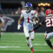 Dec 22, 2024; Atlanta, Georgia, USA; New York Giants wide receiver Malik Nabers (1) runs after a catch against the Atlanta Falcons in the fourth quarter at Mercedes-Benz Stadium. Mandatory Credit: Brett Davis-Imagn Images