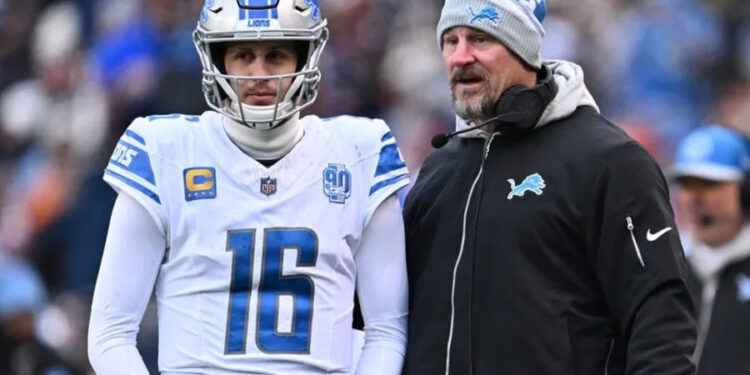 Dec 10, 2023; Chicago, Illinois, USA; Detroit Lions head coach Dan Campbell talks with quarterback Jared Goff (16) in the first half against the Chicago Bears at Soldier Field. credits: Jamie Sabau-USA TODAY Sports