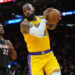 Dec 4, 2024; Miami, Florida, USA; Los Angeles Lakers forward LeBron James (23) grabs a rebound in front of Miami Heat forward Jimmy Butler (22) in the first half at Kaseya Center. Mandatory Credit: Jim Rassol-Imagn Images