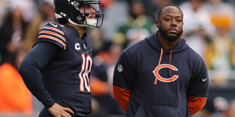 CHICAGO, ILLINOIS - NOVEMBER 17: Caleb Williams #18 and offensive coordinator Thomas Brown of the Chicago Bears look on prior to the game against the Green Bay Packers at Soldier Field on November 17, 2024 in Chicago, Illinois. (Photo by Michael Reaves/Getty Images)