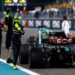 ABU DHABI, UNITED ARAB EMIRATES - DECEMBER 08: 4th placed Lewis Hamilton of Great Britain and Mercedes waves to the crowd after performing donuts on track for his final race with Mercedes during the F1 Grand Prix of Abu Dhabi at Yas Marina Circuit on December 08, 2024 in Abu Dhabi, United Arab Emirates. (Photo by Joe Portlock/Getty Images)