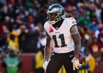 LANDOVER, MD - DECEMBER 22: A.J. Brown #11 of the Philadelphia Eagles celebrates after catching a pass for a touchdown against the Washington Commanders during the first half of the game at Northwest Stadium on December 22, 2024 in Landover, Maryland. (Photo by Scott Taetsch/Getty Images)