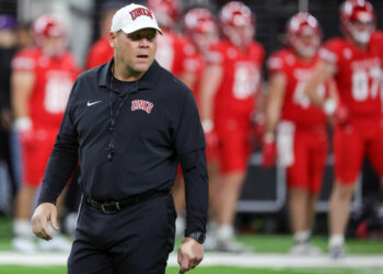 LAS VEGAS, NEVADA - NOVEMBER 30: Head coach Barry Odom of the UNLV Rebels walks on the field during warmups before a game against the Nevada Wolf Pack at Allegiant Stadium on November 30, 2024 in Las Vegas, Nevada. The Rebels defeated the Wolf Pack 38-14. (Photo by Ethan Miller/Getty Images)