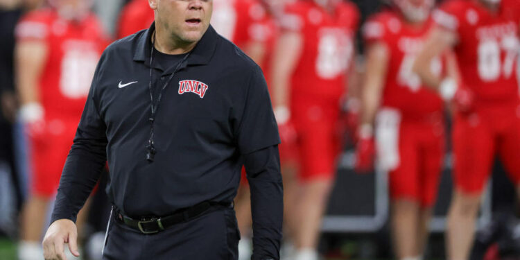 LAS VEGAS, NEVADA - NOVEMBER 30: Head coach Barry Odom of the UNLV Rebels walks on the field during warmups before a game against the Nevada Wolf Pack at Allegiant Stadium on November 30, 2024 in Las Vegas, Nevada. The Rebels defeated the Wolf Pack 38-14. (Photo by Ethan Miller/Getty Images)