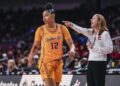 Southern California guard JuJu Watkins (12) looks back as her head coach Lindsay Gottlieb.