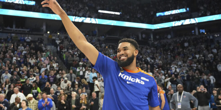 New York Knicks center Karl-Anthony Towns acknowledges the crowd before an NBA basketball game against the Minnesota Timberwolves, Thursday, Dec. 19, 2024, in Minneapolis. (AP Photo/Abbie Parr)