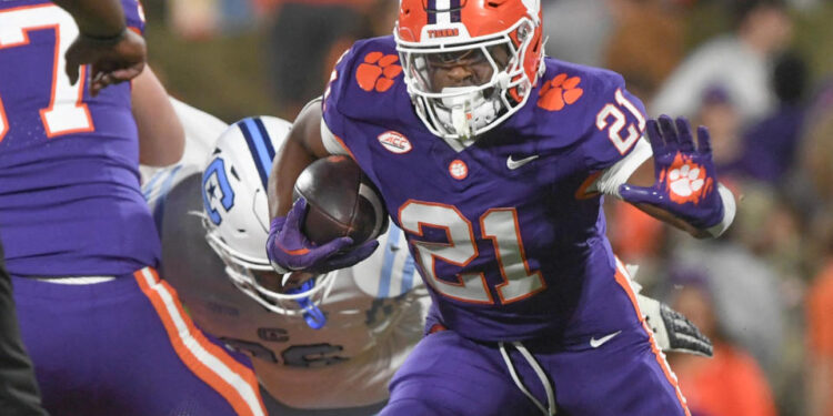 Nov 23, 2024; Clemson, South Carolina, USA; Clemson Tigers running back Jarvis Green (21) runs against The Citadel Bulldogs during the fourth quarter at Memorial Stadium. Mandatory Credit: Ken Ruinard-Imagn Images