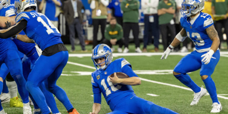 Dec 5, 2024; Detroit, Michigan, USA; Detroit Lions quarterback Jared Goff (16) burns some time off of the clock late in the fourth quarter of the game against the Green Bay Packers at Ford Field. Mandatory Credit: David Reginek-Imagn Images