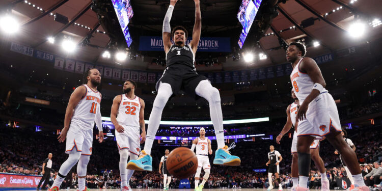 NEW YORK, NEW YORK - DECEMBER 25: Victor Wembanyama #1 of the San Antonio Spurs dunks the ball against the New York Knicks  during the second quarter at Madison Square Garden on December 25, 2024 in New York City. NOTE TO USER: User expressly acknowledges and agrees that, by downloading and or using this photograph, User is consenting to the terms and conditions of the Getty Images License Agreement.  (Photo by Luke Hales/Getty Images)