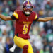 Dec 22, 2024; Landover, Maryland, USA; Washington Commanders quarterback Jayden Daniels (5) celebrates after throwing a touchdown during the fourth quarter against the Philadelphia Eagles at Northwest Stadium. Mandatory Credit: Peter Casey-Imagn Images