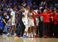 LEXINGTON, KY - DECEMBER 14: Coaches and officials attempt to break up a fight in a game between the Louisville Cardinals and the Kentucky Wildcats on December 14, 2024, at Rupp Arena in Lexington, KY. (Photo by Jeff Moreland/Icon Sportswire via Getty Images)