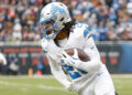 Detroit Lions running back Jahmyr Gibbs (26) runs with the ball during the first half of an NFL football game against the Chicago Bears, Sunday, Dec. 22, 2024, in Chicago. (AP Photo/Kamil Krzaczynski)