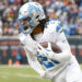 Detroit Lions running back Jahmyr Gibbs (26) runs with the ball during the first half of an NFL football game against the Chicago Bears, Sunday, Dec. 22, 2024, in Chicago. (AP Photo/Kamil Krzaczynski)