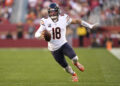 SANTA CLARA, CALIFORNIA - DECEMBER 08: Caleb Williams #18 of the Chicago Bears runs with the ball against the San Francisco 49ers in the fourth quarter at Levi's Stadium on December 08, 2024 in Santa Clara, California. (Photo by Thearon W. Henderson/Getty Images)