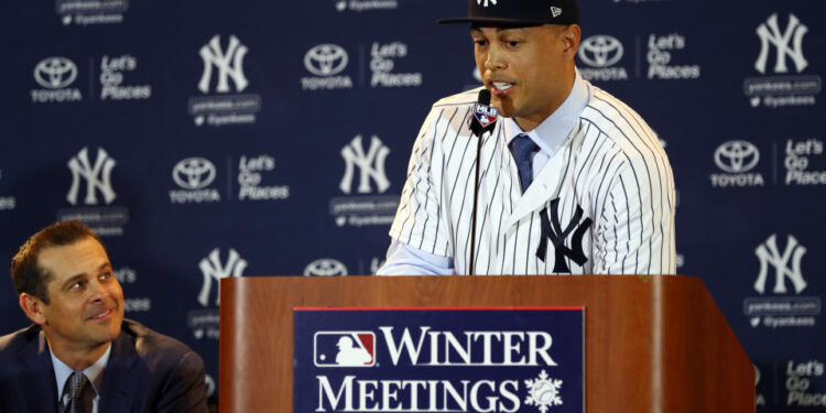 Giancarlo Stanton was introduced as a brand-new member of the New York Yankees at the 2017 winter meetings in Orlando. (Photo by Alex Trautwig/MLB via Getty Images)