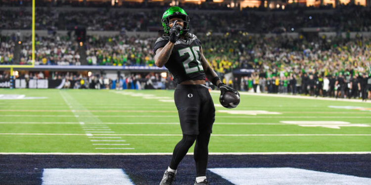 INDIANAPOLIS, INDIANA - DECEMBER 07: Jordan James #20 of the Oregon Ducks reacts after scoring a touchdown during the first half of the 2024 Big Ten Football Championship game against the Penn State Nittany Lions at Lucas Oil Stadium on December 07, 2024 in Indianapolis, Indiana. (Photo by Aaron J. Thornton/Getty Images)