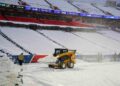 Snow is cleared from the field at Highmark Stadium in Orchard Park, N.Y., on Sunday. Gregory Fisher / Imagn Images