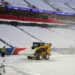 Snow is cleared from the field at Highmark Stadium in Orchard Park, N.Y., on Sunday. Gregory Fisher / Imagn Images