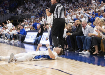 Creighton's Steven Ashworth celebrates after a foul was called on Kansas that knocked him to the floor during the first half of an NCAA college basketball game Wednesday, Dec. 4, 2024, in Omaha, Neb. (AP Photo/Rebecca S. Gratz)