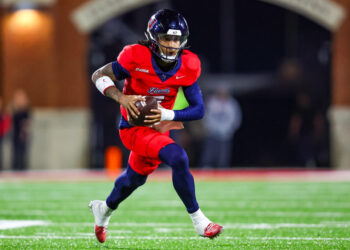 LYNCHBURG, VIRGINIA - OCTOBER 30: Kaidon Salter #7 of the Liberty Flames runs the ball during the first half of a football game against the Jacksonville State Gamecocks at Williams Stadium on October 30, 2024 in Lynchburg, Virginia.  (Photo by David Jensen/Getty Images)