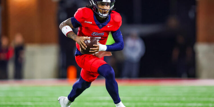 LYNCHBURG, VIRGINIA - OCTOBER 30: Kaidon Salter #7 of the Liberty Flames runs the ball during the first half of a football game against the Jacksonville State Gamecocks at Williams Stadium on October 30, 2024 in Lynchburg, Virginia.  (Photo by David Jensen/Getty Images)