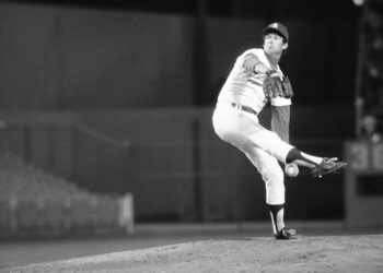 The Dodgers' Tommy John delivers during a game on April 29, 1976 against the Pirates for his first win after the procedure.