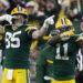 Dec 23, 2024; Green Bay, Wisconsin, USA;  Green Bay Packers wide receiver Jayden Reed (11) reacts with tight end Tucker Kraft (85) after cathing a first down pass against the New Orleans Saints at Lambeau Field. Mandatory Credit: Wm. Glasheen USA TODAY NETWORK-Wisconsin/Imagn Images