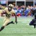 FOXBOROUGH, MA - DECEMBER 09: Army Black Knights running back Kanye Udoh (26) pursued by Navy Midshipmen defensive end Mbiti Williams Jr. (7) during the 124th Army-Navy football game on December 9, 2023, at Gillette Stadium in Foxborough, MA. (Photo by M. Anthony Nesmith/Icon Sportswire via Getty Images)