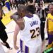 Lakers star LeBron James hugs teammate Austin Reaves after Reaves scored the winning basket against the Warriors.