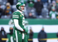 EAST RUTHERFORD, NEW JERSEY - DECEMBER 22: Aaron Rodgers #8 of the New York Jets on the field before the game against the Los Angeles Rams at MetLife Stadium on December 22, 2024 in East Rutherford, New Jersey. (Photo by Emilee Chinn/Getty Images)