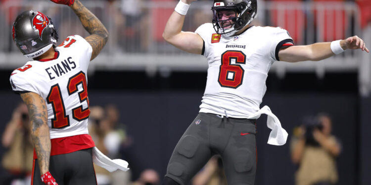 Baker Mayfield and Mike Evans can help their own pocketbooks, the Bucs' playoff chances and fantasy managers with a big finish to the season. (Photo by Todd Kirkland/Getty Images)