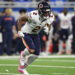 Chicago Bears wide receiver DJ Moore runs in motion during the first half of an NFL football game against the Detroit Lions in Detroit, Thursday, Nov. 28, 2024. The Lions won 23-20. (AP Photo/David Dermer)