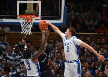 Dec 4, 2024; Durham, North Carolina, USA; Duke Blue Devils forward Cooper Flagg (2) blocks a shot by Auburn Tigers guard Denver Jones (2) during the second half at Cameron Indoor Stadium.  The Blue Devils won 84-78.   Mandatory Credit: Rob Kinnan-Imagn Images