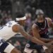 Los Angeles Clippers guard James Harden holds the ball against Minnesota Timberwolves.