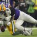 Green Bay Packers' Josh Jacobs fumbles as he is hit by Minnesota Vikings' Jerry Tillery. (AP Photo/Abbie Parr)